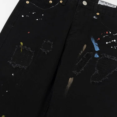 DISTRESSED BLACK FLARED JEANS